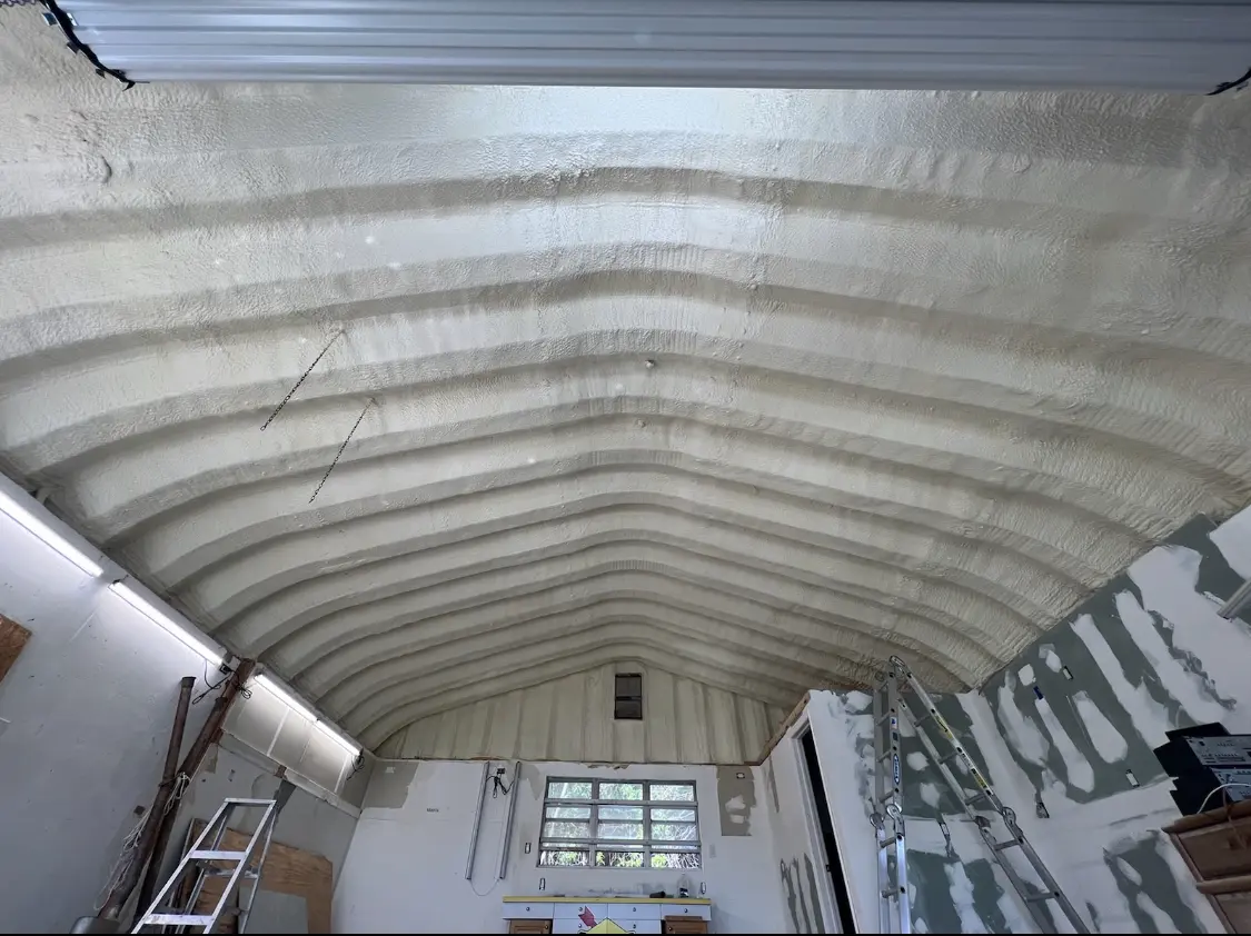 Spray polyurethane foam applied to the underside of a metal roof deck in Tiverton